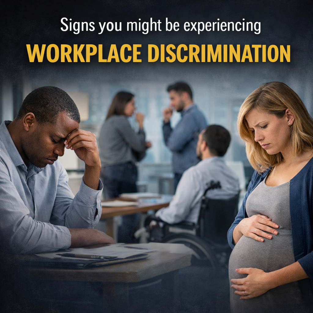 Employees appearing stressed and excluded in an office setting illustrating signs of workplace discrimination in San Diego, CA